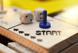 Board game showing the start personal finance journey