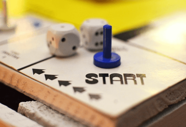 Board game showing the start personal finance journey